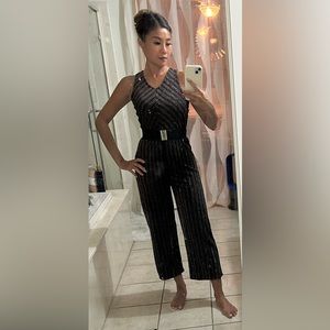 Jumpsuit with shiny lined patterns. Size S